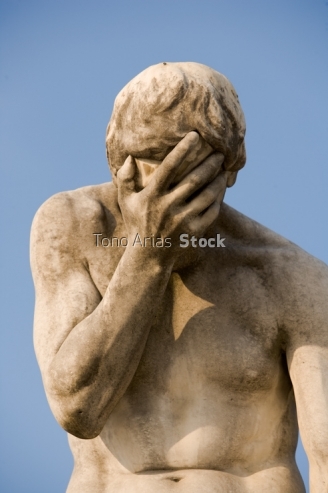Statue of Person Covering Face